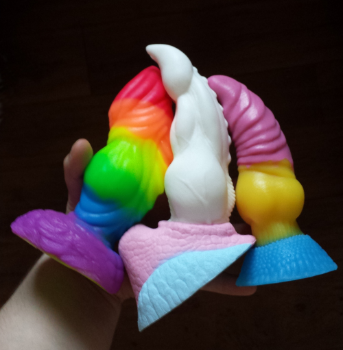 Trio of pride flag dildos.