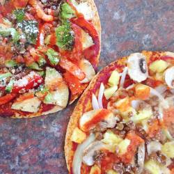 started:  dinner was two homemade vegan pizzas 🍕🍕🍕🍕🍕both pizza has tomato paste, lentils, sriracha + vegan cheese! one has pineapple, mushroom and onion while the other has broccoli, eggplant and red pepper 😻😼 