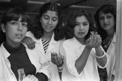 warkadang:  Kabul, 1986 Young female students attend a chemistry course at the university. Photograph by Abbas.  