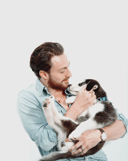 aarontjsource:Aaron Taylor-Johnson holding a puppy