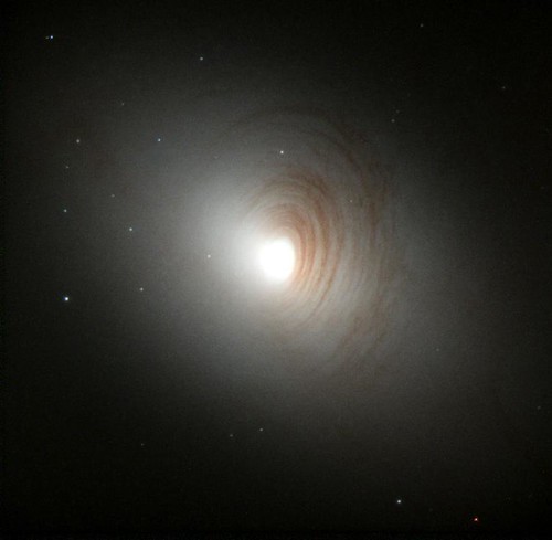 Dusty Arms Encircle Nucleus of Galaxy NGC 2787 by NASA Hubble