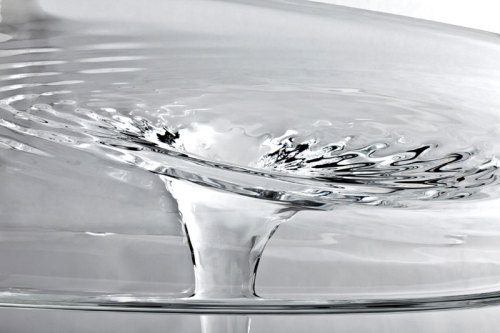 sixpenceee:  Mesa Table designed by Zaha Hadid, is a glass table that looks like flowing water. (Website)