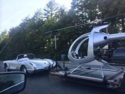 blazepress:  Classic Corvette towing a helicopter. This man is winning at life.