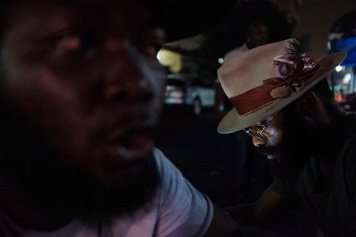 Friends gather for drinks late night in Osu. January 24, 2019. Ghana. Photo: Francis Kokoroko @accra