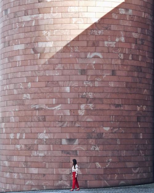 Reddish stone wall at Museum Tinguely in Basel, Switzerland. Designed by Mario Botta. Built between 