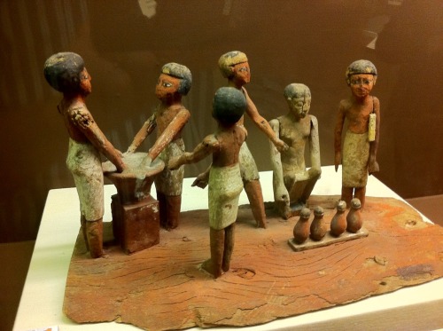 Ancient Egyptian wooden figurines making beer, currently on display at the Rosicrucian Egyptian Muse