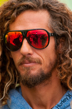 surfing-the-salt-life:  Rob Machado taken during the 2011 Hurley Pro at Trestles in Southern California. This was taken right before he an interview was about to take place. You can kind of see the set up in his glasses. J Fennell Photo 