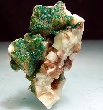 ibrain-aneurysm:  sixpenceee:  The above is dioptase on duftite and calcite. (Source)  Thats super pretty. I found a new favorite crystal. 
