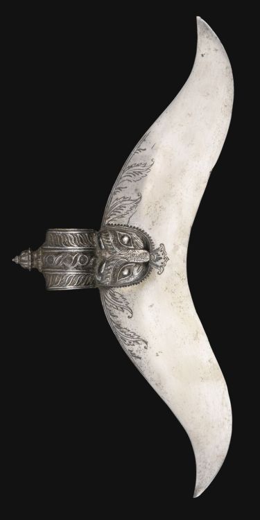 A Tipu sultan bubri-form axe-head with tiger’s head, Mysore, late 18th centuryThe steel blade 