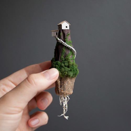 archatlas:  Miniature Houses on Cork Cliffs Float Inside Handmade Wooden Frames by Rosa de Jong  Designer Rosa de Jong produces micro homes that are built into the side of tiny cliffs constructed out of cork. Her miniature environments are covered in