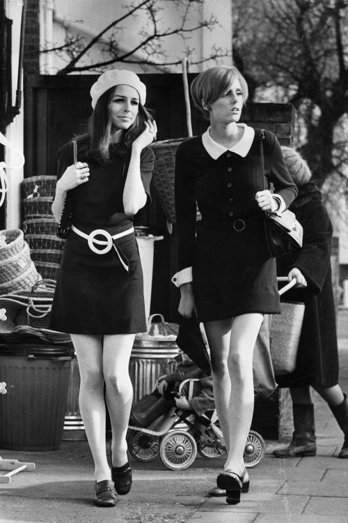 1968Two young girls embrace the mod look while shopping in London.