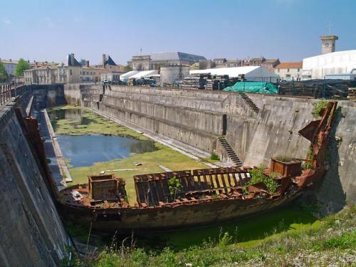 abandonedandurbex:Rochefort - The Napoléon III, a 19th-century drydock, with the remains of the boat