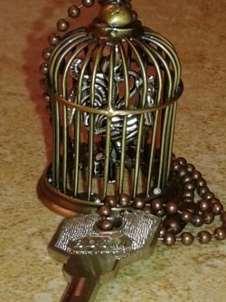 cutyvie:  I made this chastity key fob for my wife. The caged cock is the universal code for a male locked in chastity. She can take the key out of her purse and place it on the table whenever we are out in public. If someone asks about the key, she will