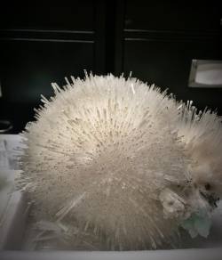 thebrainscoop:  Mesolite sphere; a silicate mineral that forms in incredibly delicate, needle-like structures. That’s some impressive geology right there.  (at The Field Museum)