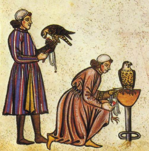 Two falconers in an illustration from De Arte Venandi cum Avibus, or On The Art of Hunting