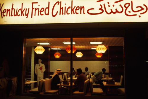 An American restaurant chain is patroned by local Abu Dhabian men, October 1975.Photograph by Winfie