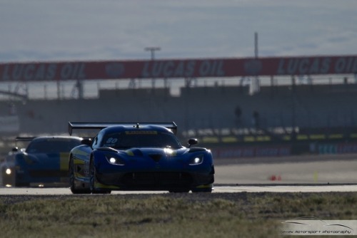 Harsh desert light overshadows the N° 80 Dodge Viper GT3-R while headlights pierce its silhouette du