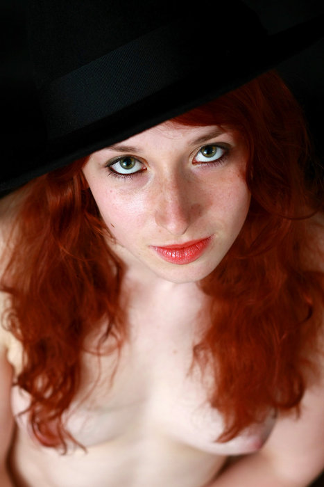 Pretty eyes and cute tits on this redhead adult photos