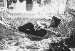 karinabeat:    Mick Jagger lies in a hammock and strums a guitar at Stephen Stills’ house in Laurel Canyon, California, October 1969 - Terry O'Neill