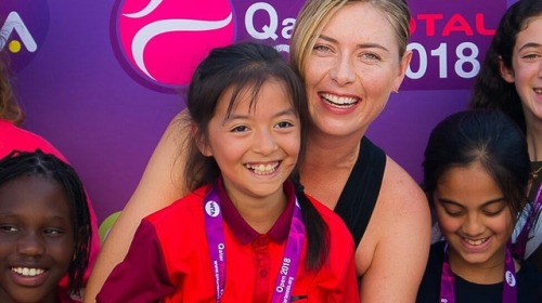 alwayswithsharapova:Maria Sharapova with the kids on meet & greet at Doha, Qatar.