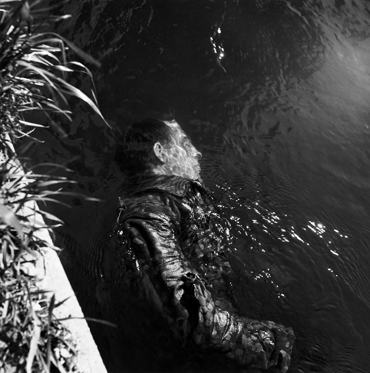 mrmonst3r: SS Guard in Canal, Dachau, Germany, 1945
