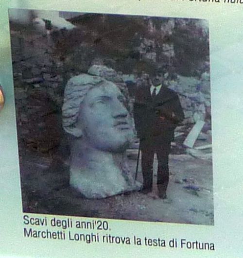 A head of Fortuna Huiusce DieiA detail of info board at Area Sacra di Largo Argentina. I was just br