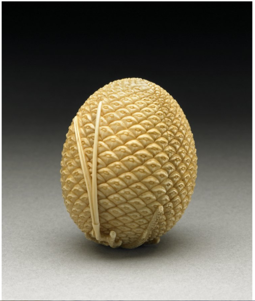 Okimono in the shape of a pine cone which opens to reveal an erotic sceneJapan, 19th C. made of ivor