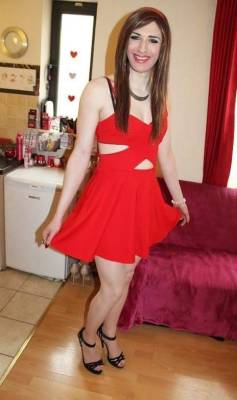 zoeross:  Crossdresser in red cut out dress