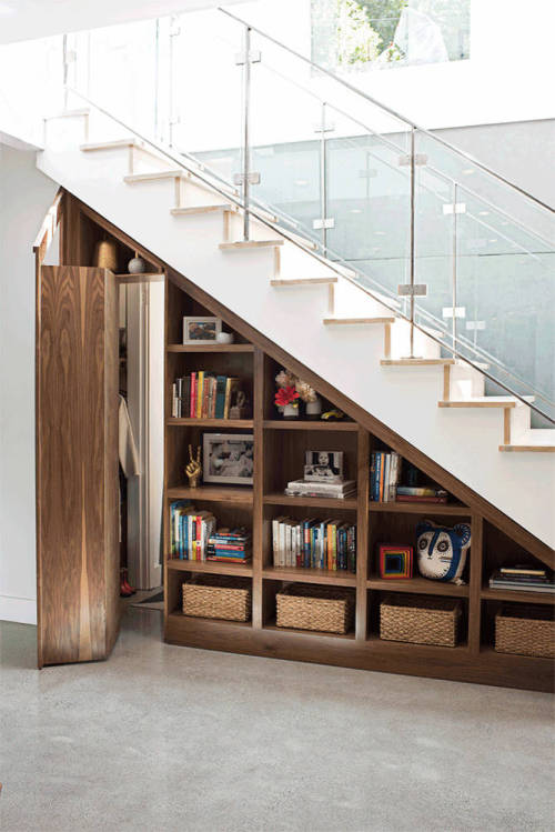 remodelproj:Secret door behind bookcase underneath stairs