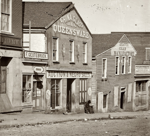 A black Union soldier is posted at a slave auction house on Whitehall Street, Atlanta, Georgia durin