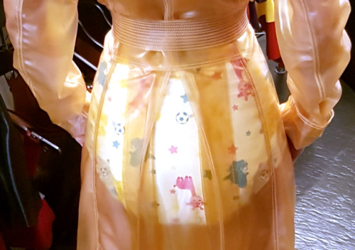   I’m visiting DeMask fetish boutique wearing a diaper (12 pics)I went shopping at DeMask, fetish boutique in Amsterdam. I tried on two transparent latex coats. I wore nothing underneath. Well, nothing but the bare neccesities ;-)See 12 pics of my visit:h