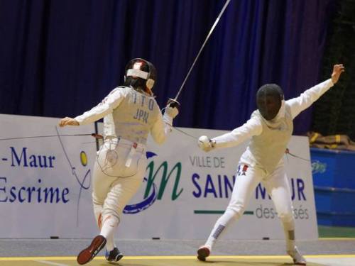 modernfencing:[ID: a foilist crossing over as her opponent counterattacks.]Maki Ito (left) against A