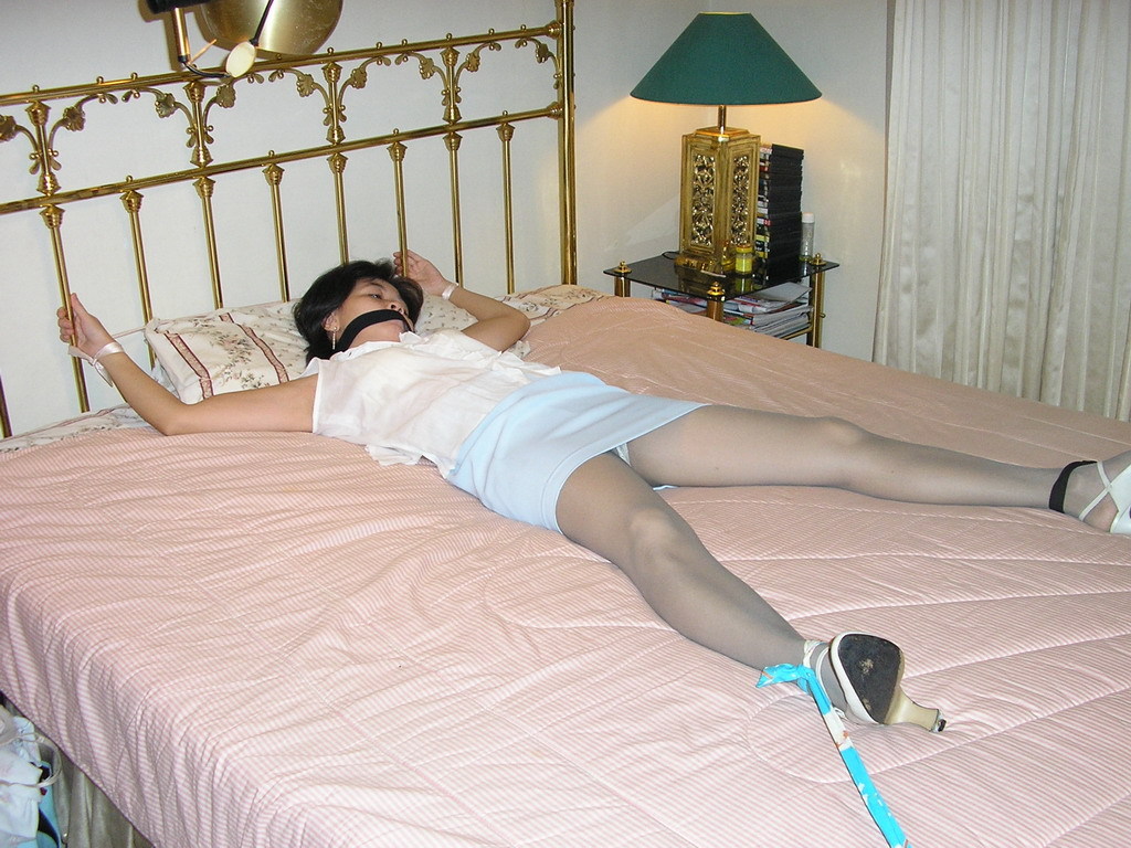 Tied up wife spread eagle on bed