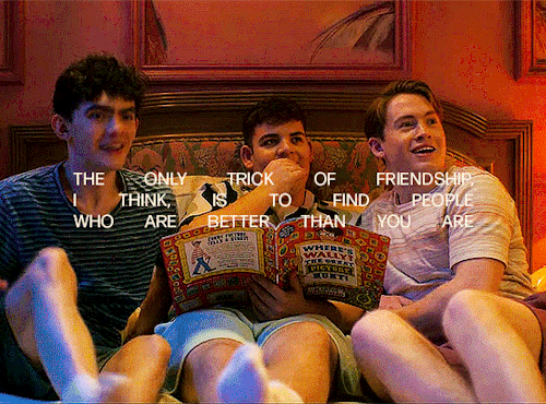 Nick, Isaac and Charlie are laying on their hotel bed in Paris. They're looking at someone and get excited, so they get off the bed. The shot switches to Elle, who's sitting on another hotel bed. Across from her are sitting Darcy, Sahar and Darcy. While screaming excitedly, they're getting up to hug Elle. The text in the gif says: "The only trick of friendship, I think, is to find people who are better than you are"