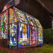 Greenhouse made from recycled church stained glass windows by Heywood & Condie.