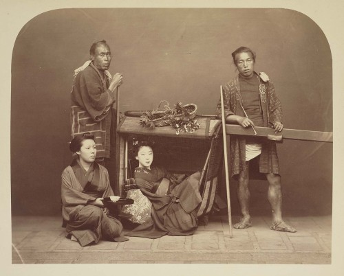 Lady in palanquin with maid and carriers, ca. 1875, by anonymous Japanese photographer