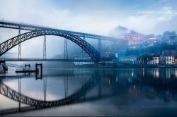 the-undiscovered-countries:  Ponte Dom Luís, Porto, Portugal (by António Gaudencio) Join me on my journey to all the undiscovered countries. 