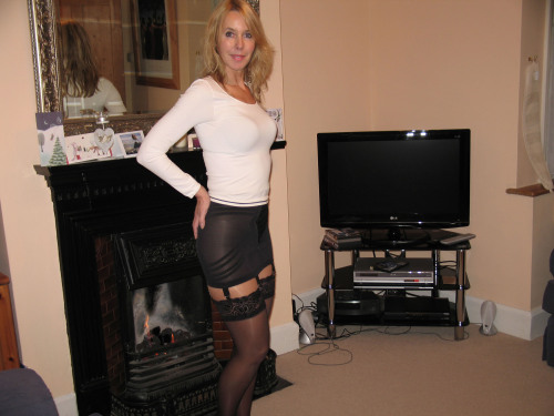 slutwifegallery: Black nylons are a must for any Slutwife dress.