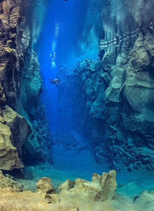 sixpenceee:The crevice between the North American and Eurasian tectonic plates near Iceland. Can you