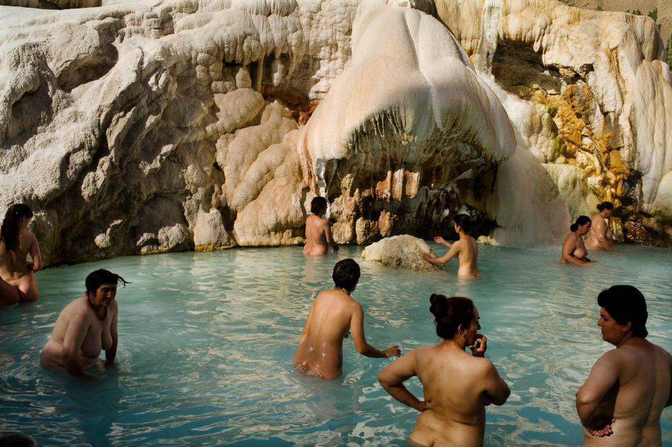 From Paradise Rivers, by Carolyn Drake.     Women soak in the main pool at Garm Chashma,