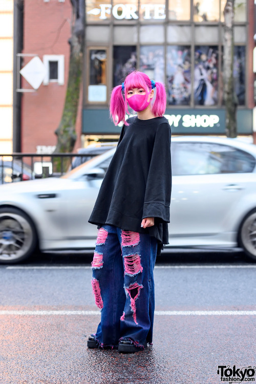 Japanese hair stylist Paso on the street in Harajuku with pink twintails, a pink face mask, an overs