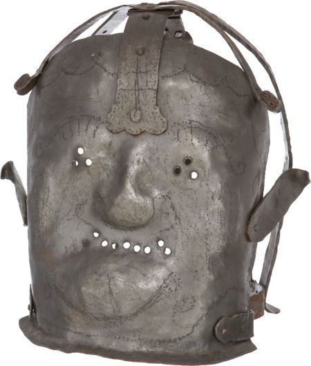 dichotomized:  Insanity Mask: A metal mask, used to restrain individuals deemed insane in the 17th-century. It was designed to lock the mask on the head of the insane person. 