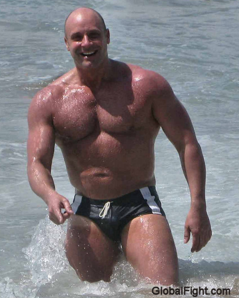 wrestlerswrestlingphotos:  muscle men swimming beach