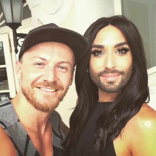 August 10, 2015Conchita at the opening concert of the 5th Prague Pride in a red silk jumpsuit from C