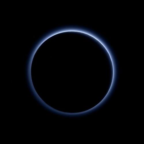 photos-of-space:Pluto’s blue haze layer caused by sunlight-initiated chemical reactions of nitrogen 