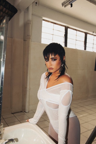 artofstartinover:Demi Lovato - Skin of my adult photos