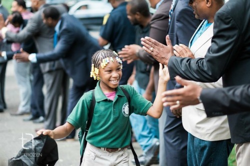 cleophatracominatya:nousverrons:Nearly 100 black men greeted children at an elementary school in Har