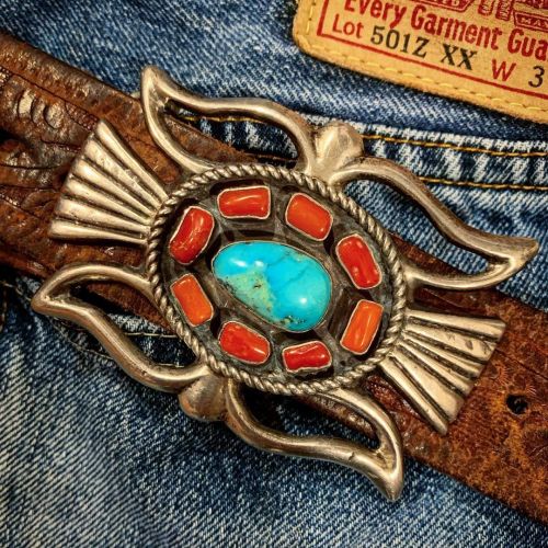 70’s era sandcast silver Navajo belt buckle with turquoise and orange coral accents paired with a vi