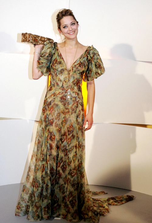 marioncotillardaily:  Marion Cotillard after winning Best Supporting Actress for her performance in  A Very Long Engagement at the 30th César Awards on February 26, 2005 in Paris, France.