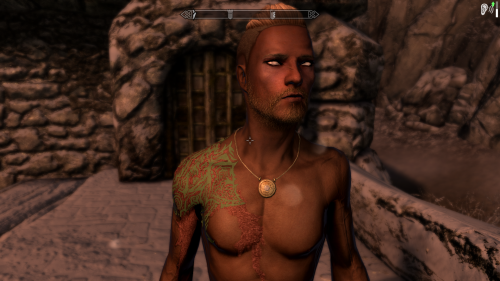 Yorrik, a Nord. His father was a great blacksmith, but when he began to experiment with Daedric forging, an…. accident occurred. THe piece exploded, giving Yorrik the scars on his face, burning out both his eyes, and essentially severing his right arm. Luckily, a group of Vigilants of Sendar were near, hearing rumors of someone experimenting with Daedric magic. They were able to save Yorrik’s life, and through months of intense magical and mundane healing, he was given a prosthetic right arm that could activate a Ward spell. His eyes are actually crystals enchanted with Life Sense, so though he does not see as most do, he knows where creatures are. (His right arm was….. meant to be completely black, but apparently I have no hand tattoos downloaded, so we use our imaginations-)Because of this, he absolutely refuses to engage in martial combat. He studies magic, rapidly switching between spells of every school on his left hand while his right arm maintains a Ward on its own.Bathes In Flames(Bif from here to be short) was meant to be a Shadowscale. He was born under the sign of Sithis, and though there was no known chapter of the Brotherhood in Hammerfell(where he was born), Bif’s parents continued training him in the ways of stealth and death, hoping one day a Speaker would come for him. Most of his scars are from his own family, as their training was…. intense. He excelled at his training, but… he hated it. He hated the bloodshed. One day, as both parents attacked him, trying to teach him to avoid sneak attacks…. he snapped. Bif slew them both and, fearing what would become of an Argonian murderer in the land of Redguards, but not wanting to meet more devoted Shadowscale supporters, he flew to Elsewyr. There he fell in with a group of monks, studying the art of fighting with no tools. Bif swore to himself and to the divines, he would never again use a device made by man, mer, or beast to end a life. He uses magic to subdue when possible, and his claws to kill only as a last resort. Eventually Bif made his way to the docks of WIndhelm, wanting to start a completely fresh life. #yorrik#bif